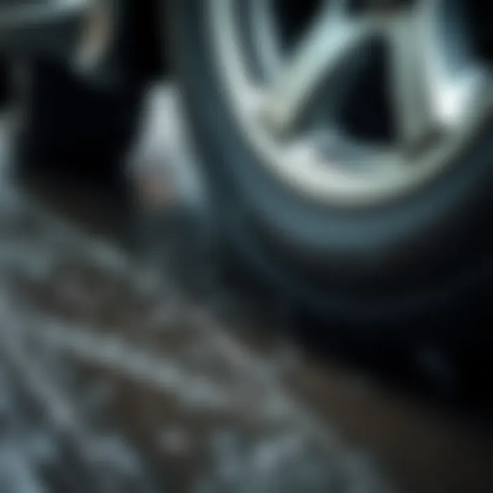 Close-up of a vehicle's tire with deep treads gripping a slick, rain-soaked surface